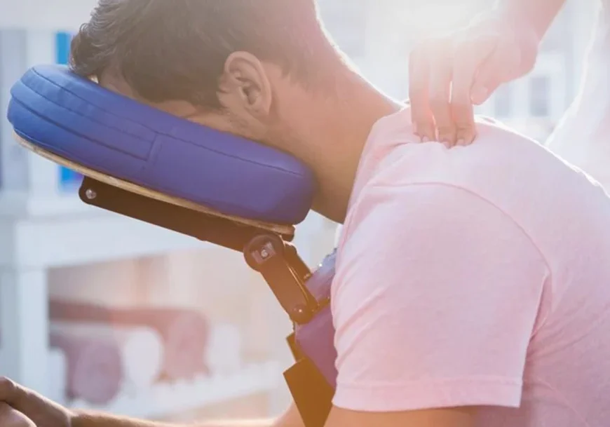 A man is getting his neck looked at by a softwave specialist in long island